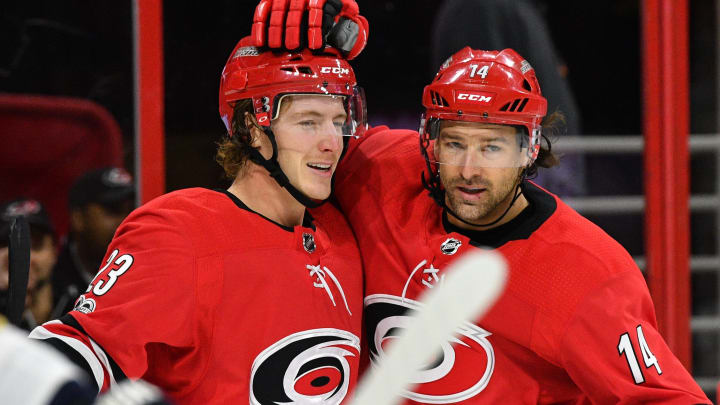 RALEIGH, NC – NOVEMBER 07: Carolina Hurricanes Right Wing Justin Williams (14) congratulates Carolina Hurricanes Right Wing Brock McGinn (23) after scoring a goal during a game between the Florida Panthers and the Carolina Hurricanes at the PNC Arena in Raleigh, NC on November 7 2017. Carolina defeated Florida 3-1. (Photo by Greg Thompson/Icon Sportswire via Getty Images)