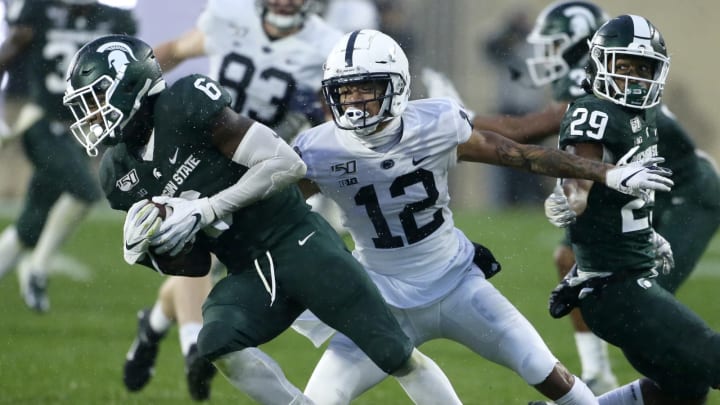 EAST LANSING, MI – OCTOBER 26: Safety David Dowell #6 of the Michigan State Spartans is pursued by wide receiver Mac Hippenhammer #12 of the Penn State Nittany Lions after making an interception during the second half at Spartan Stadium on October 26, 2019 in East Lansing, Michigan. Penn State defeated Michigan State 28-7. (Photo by Duane Burleson/Getty Images)