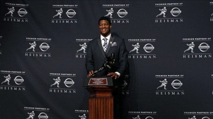 Dec 14, 2013; New York, NY, USA; Florida State Seminoles quarterback Jameis Winston poses for a photo after being awarded the 2013 Heisman Trophy at the Marriott Marquis in New York City. Mandatory Credit: Adam Hunger-USA TODAY Sports