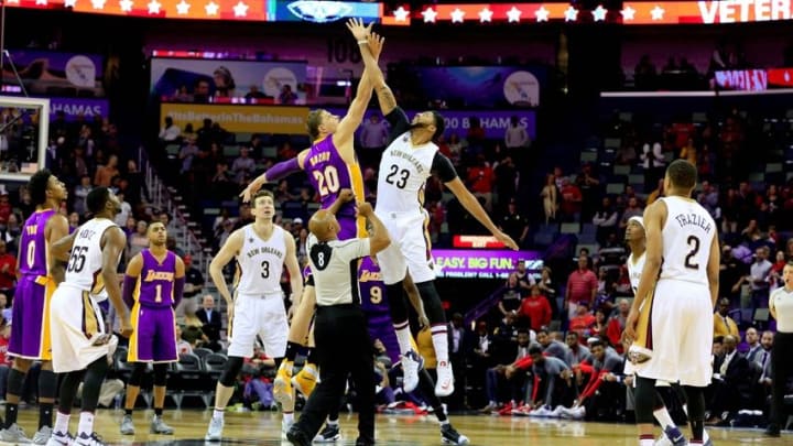 Nov 12, 2016; New Orleans, LA, USA; New Orleans Pelicans forward Anthony Davis (23) and Los Angeles Lakers center Timofey Mozgov (20) tip off for the first quarter of a game at the Smoothie King Center. Mandatory Credit: Derick E. Hingle-USA TODAY Sports