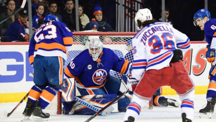 NEW YORK, NEW YORK – JANUARY 12: Robin Lehner #40 of the New York Islanders stares down the puck as Mats Zuccarello #36 of the New York Rangers prepares to shoot during the third period of the game at Barclays Center on January 12, 2019 in the Brooklyn borough of New York City. The goal by Zuccarello put the New York Rangers up 2-1. (Photo by Sarah Stier/Getty Images)