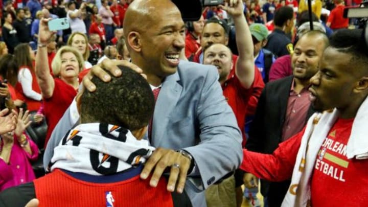 Apr 15, 2015; New Orleans, LA, USA; New Orleans Pelicans head coach Monty Williams celebrates with guard Eric Gordon (10) following a win against the San Antonio Spurs at the Smoothie King Center. The Pelicans defeated the Spurs 108-103 to earn the 8th seed in the Western Conference Playoffs. Mandatory Credit: Derick E. Hingle-USA TODAY Sports