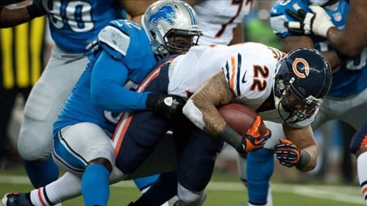 Dec 30, 2012; Detroit, MI, USA; Detroit Lions outside linebacker Justin Durant (52) tackles Chicago Bears running back Matt Forte (22) during the first quarter at Ford Field. Mandatory Credit: Tim Fuller-USA TODAY Sports