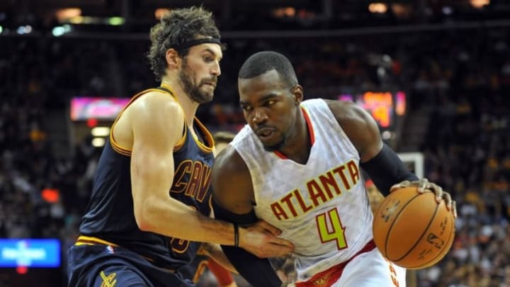 Nov 21, 2015; Cleveland, OH, USA; Atlanta Hawks forward Paul Millsap (4) drives on Cleveland Cavaliers forward Kevin Love (0) during the fourth quarter at Quicken Loans Arena. The Cavs won 109-97. Mandatory Credit: Ken Blaze-USA TODAY Sports