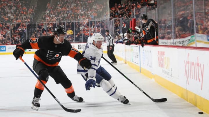 PHILADELPHIA, PENNSYLVANIA - NOVEMBER 02: Tyson Barrie #94 of the Toronto Maple Leafs carries the puck around Kevin Hayes #13 of the Philadelphia Flyers during the first period at the Wells Fargo Center on November 02, 2019 in Philadelphia, Pennsylvania. (Photo by Bruce Bennett/Getty Images)
