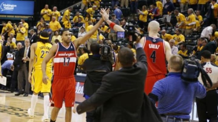 May 5, 2014; Indianapolis, IN, USA; Washington Wizards guard Garrett Temple (17) and center Marcin Gortat (4) celebrate a victory against the Indiana Pacers in game one of the second round of the 2014 NBA Playoffs at Bankers Life Fieldhouse. Washington won 102-96. Mandatory Credit: Brian Spurlock-USA TODAY Sports