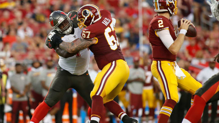 TAMPA, FL – AUGUST 31: Offensive guard Kyle Kalis #67 of the Washington Redskins protects quarterback Nate Sudfeld #2 from defensive tackle Channing Ward #71 of the Tampa Bay Buccaneers during the first quarter of an NFL preseason football game on August 31, 2017 at Raymond James Stadium in Tampa, Florida. (Photo by Brian Blanco/Getty Images)