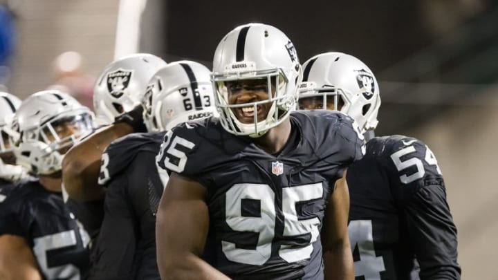 Sep 1, 2016; Oakland, CA, USA; Oakland Raiders defensive end Jihad Ward (95) smiles after a play against the Seattle Seahawks during the second quarter at Oakland Coliseum. Mandatory Credit: Kelley L Cox-USA TODAY Sports