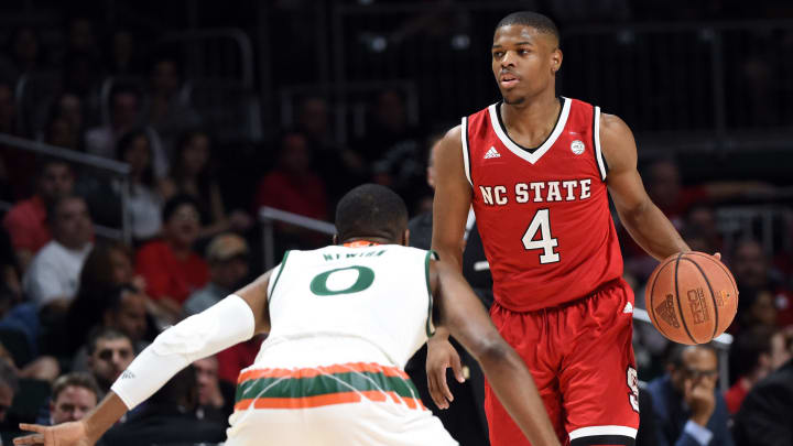 Dec 31, 2016; Coral Gables, FL, USA; North Carolina State Wolfpack guard Dennis Smith Jr. (4) dribbles the ball against Miami Hurricanes guard Ja’Quan Newton (0) during the first half at Watsco Center. Mandatory Credit: Steve Mitchell-USA TODAY Sports