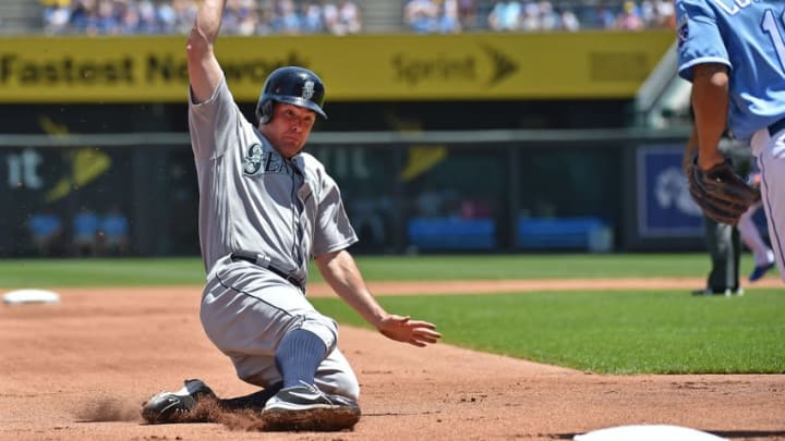 Jul 10, 2016; Kansas City, MO, USA; Seattle Mariners base runner Seth Smith (7) slides safely into third base against the Kansas City Royals during the first inning at Kauffman Stadium. Mandatory Credit: Peter G. Aiken-USA TODAY Sports