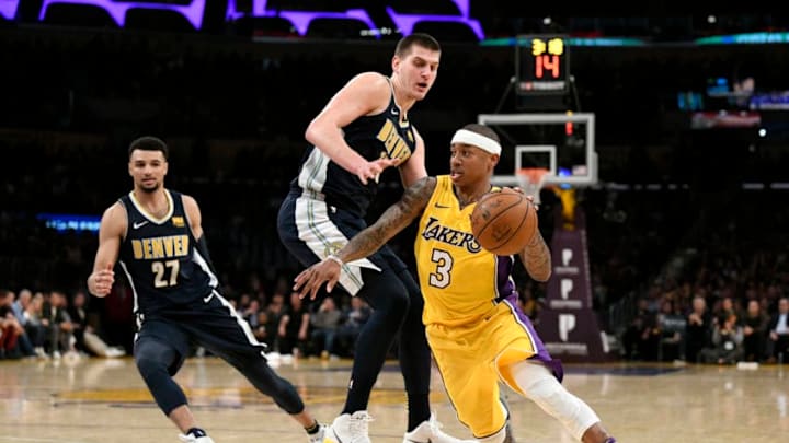 LOS ANGELES, CA - MARCH 13: Isaiah Thomas #3 of the Los Angeles Lakers gets around Nikola Jokic #15 of the Denver Nuggets on March 13, 2018 at STAPLES Center in Los Angeles, California. NOTE TO USER: User expressly acknowledges and agrees that, by downloading and or using this photograph, User is consenting to the terms and conditions of the Getty Images License Agreement.  (Photo by Robert Laberge/Getty Images)