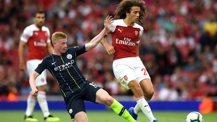 LONDON, ENGLAND - AUGUST 12: Kevin De Bruyne of Manchester City and Matteo Guendouzi of Arsenal battle for the ball during the Premier League match between Arsenal FC and Manchester City at Emirates Stadium on August 12, 2018 in London, United Kingdom. (Photo by Shaun Botterill/Getty Images)