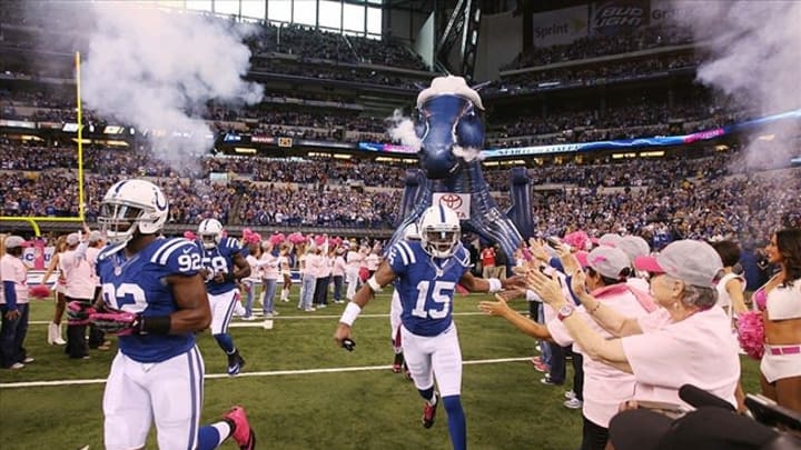 Oct 7, 2012; Indianapolis, IN, USA; Indianapolis Colts wide receiver LaVon Brazill (15) runs onto the field during player introductions before the game against the Green Bay Packers at Lucas Oil Stadium. Indianapolis defeated Green Bay 30-27. Mandatory Credit: Brian Spurlock-USA TODAY Sports