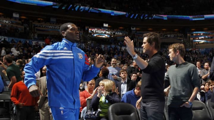 OKLAHOMA CITY, OK - FEBRUARY 23: Actor Rob Lowe high fives Royal Ivey of the Oklahoma City Thunder before the game against the Los Angeles Lakers on February 23, 2012 at the Chesapeake Energy Arena in Oklahoma City, Oklahoma. NOTE TO USER: User expressly acknowledges and agrees that, by downloading and or using this Photograph, user is consenting to the terms and conditions of the Getty Images License Agreement. Mandatory Copyright Notice: Copyright 2012 NBAE (Photo by Layne Murdoch/NBAE via Getty Images)