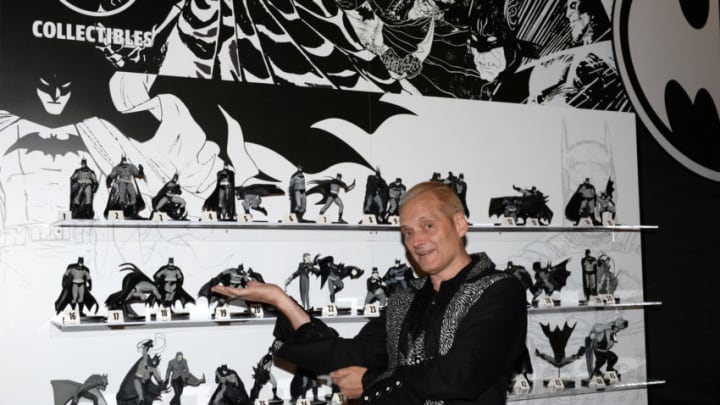 SAN DIEGO, CALIFORNIA - JULY 17: DC Collectibles Creative Director Jim Fletcher poses with Batman figurines during The Batman Experience powered by AT&T and Comic-Con Museum character Hall Of Fame induction at Comic Con Museum on July 17, 2019 in San Diego, California. (Photo by Andrew Toth/Getty Images for DC)