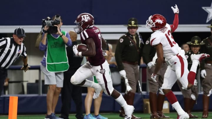 ARLINGTON, TX - SEPTEMBER 29: Jashaun Corbin #7 of the Texas A&M Aggies runs the ball past Nate Dalton #13 of the Arkansas Razorbacks for a 100 yard touchdown opening kickoff return during Southwest Classic at AT&T Stadium on September 29, 2018 in Arlington, Texas. (Photo by Ronald Martinez/Getty Images)