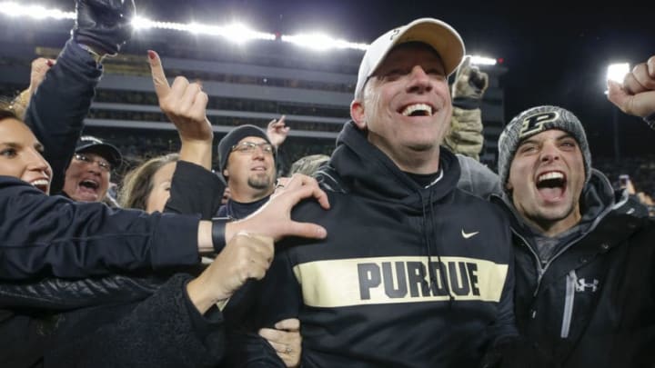 WEST LAFAYETTE, IN - OCTOBER 20: Head coach Jeff Brohm of the Purdue Boilermakers is mobbed by fans after the upset win over the Ohio State Buckeyes at Ross-Ade Stadium on October 20, 2018 in West Lafayette, Indiana. (Photo by Michael Hickey/Getty Images) WEST LAFAYETTE, IN - OCTOBER 20: Head coach Jeff Brohm of the Purdue Boilermakers is mobbed by fans after the upset win over the Ohio State Buckeyes at Ross-Ade Stadium on October 20, 2018 in West Lafayette, Indiana. (Photo by Michael Hickey/Getty Images)