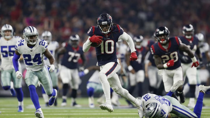 HOUSTON, TX – OCTOBER 07: DeAndre Hopkins #10 of the Houston Texans breaks free from the tackle by Byron Jones #31 of the Dallas Cowboys in the first quarter at NRG Stadium on October 7, 2018 in Houston, Texas. (Photo by Tim Warner/Getty Images)