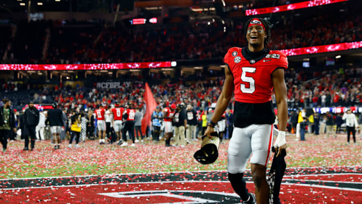 INGLEWOOD, CALIFORNIA - JANUARY 09: Adonai Mitchell #5 of the Georgia Bulldogs celebrates after defeating the TCU Horned Frogs in the College Football Playoff National Championship game at SoFi Stadium on January 09, 2023 in Inglewood, California. Georgia defeated TCU 65-7. (Photo by Ronald Martinez/Getty Images)