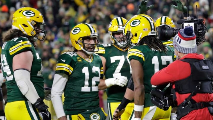 Green Bay Packers quarterback Aaron Rodgers (12) celebrates with wide receiver Davante Adams (17) after Adams scored a touchdown against the Chicago Bears in the fourth quarter during their football game Sunday, December 12, 2021, at Lambeau Field in Green Bay, Wis. Dan Powers/USA TODAY NETWORK-WisconsinApc Packvsbears 1212211903djp