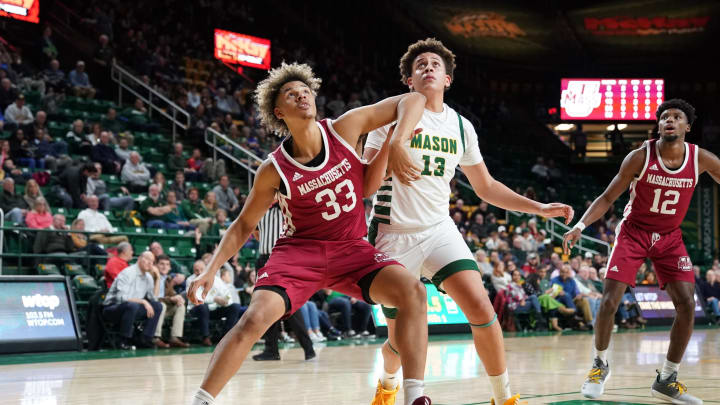 WASHINGTON, DC – JANUARY 26: Tre Mitchell #33 of the Massachusetts Minutemen and Josh Oduro #13 of the George Mason Patriots fight for position during a college basketball game at the Eagle Bank Arena on January 26, 2020 in Washington, DC. (Photo by Mitchell Layton/Getty Images)