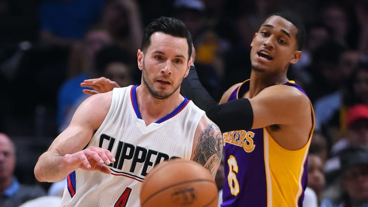 Apr 1, 2017; Los Angeles, CA, USA; Los Angeles Clippers guard JJ Redick (4) takes the ball past Los Angeles Lakers guard Jordan Clarkson (6) in the second half of the game at Staples Center. Clippers won 115-104. Mandatory Credit: Jayne Kamin-Oncea-USA TODAY Sports