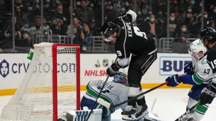 Dec 30, 2021; Los Angeles, California, USA; LA Kings center Adrian Kempe (9) shoots the puck against Vancouver Canucks goaltender Jaroslav Halak (41) in the second period at Crypto.com Arena. Mandatory Credit: Kirby Lee-USA TODAY Sports