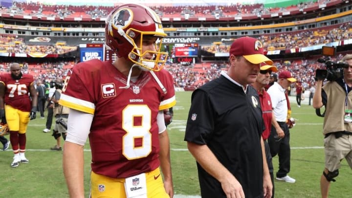 Sep 18, 2016; Landover, MD, USA; Washington Redskins quarterback Kirk Cousins (8) and Redskins head coach (R) walk off the field after their game against the Dallas Cowboys at FedEx Field. The Cowboys won 27-23. Mandatory Credit: Geoff Burke-USA TODAY Sports