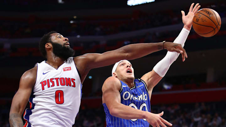 DETROIT, MICHIGAN - MARCH 28: Aaron Gordon #00 of the Orlando Magic gets his shot blocked by Andre Drummond #0 of the Detroit Pistons during the first half at Little Caesars Arena on March 28, 2019 in Detroit, Michigan. NOTE TO USER: User expressly acknowledges and agrees that, by downloading and or using this photograph, User is consenting to the terms and conditions of the Getty Images License Agreement. (Photo by Gregory Shamus/Getty Images)