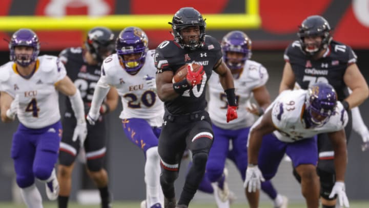 Charles McClelland of the Cincinnati Bearcats runs for touchdown during the game against the East Carolina Pirates at Nippert Stadium. Getty Images.