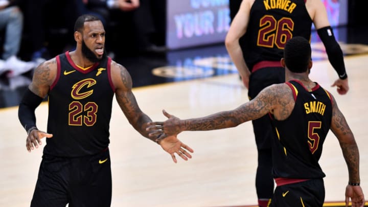 CLEVELAND, OH - MAY 21: LeBron James #23 of the Cleveland Cavaliers reacts with JR Smith #5 after a play in the first half against the Boston Celtics during Game Four of the 2018 NBA Eastern Conference Finals at Quicken Loans Arena on May 21, 2018 in Cleveland, Ohio. NOTE TO USER: User expressly acknowledges and agrees that, by downloading and or using this photograph, User is consenting to the terms and conditions of the Getty Images License Agreement. (Photo by Jamie Sabau/Getty Images)