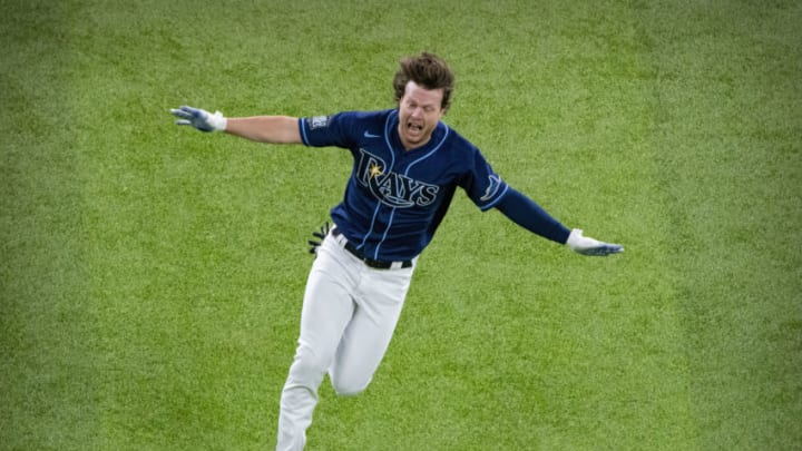 Oct 24, 2020; Arlington, Texas, USA; Tampa Bay Rays right fielder Brett Phillips (14) celebrates hitting the game winning walk off single against the Los Angeles Dodgers during the ninth inning in game four of the 2020 World Series at Globe Life Field. Mandatory Credit: Jerome Miron-USA TODAY Sports