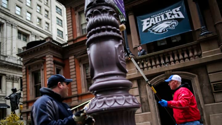 PHILADELPHIA, PA - FEBRUARY 04: Philadelphia Police officers grease traffic light poles as security measure for Super Bowl LII fans on February 4, 2018 in Philadelphia, Pennsylvania. The Philadelphia police department is using gear oil to grease up the poles on downtown streets to minimize the damage that fans can do to the city and themselves in the aftermath of the Super Bowl LII that will be played between the New England Patriots and the Philadelphia Eagles.(Photo by Eduardo Munoz Alvarez/Getty Images)