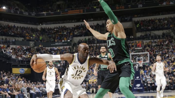 INDIANAPOLIS, IN - NOVEMBER 25: Damien Wilkins #12 of the Indiana Pacers handles the ball against Jayson Tatum #0 of the Boston Celtics on November 25, 2017 at Bankers Life Fieldhouse in Indianapolis, Indiana. NOTE TO USER: User expressly acknowledges and agrees that, by downloading and or using this Photograph, user is consenting to the terms and conditions of the Getty Images License Agreement. Mandatory Copyright Notice: Copyright 2017 NBAE (Photo by AJ Mast/NBAE via Getty Images)