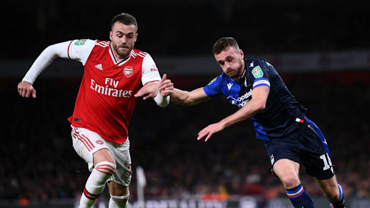 LONDON, ENGLAND - SEPTEMBER 24: Calum Chambers of Arsenal battles for the ball with Jack Robinson of Nottingham Forest during the Carabao Cup Third Round match between Arsenal FC and Nottingham Forrest at Emirates Stadium on September 24, 2019 in London, England. (Photo by Laurence Griffiths/Getty Images)