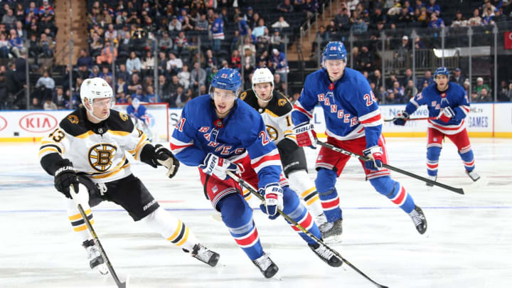 NEW YORK, NY - OCTOBER 27: Brett Howden #21 of the New York Rangers skates with the puck against Danton Heinen #43 of the Boston Bruins at Madison Square Garden on October 27, 2019 in New York City. (Photo by Jared Silber/NHLI via Getty Images)