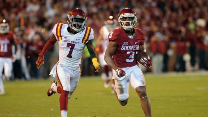 Nov 7, 2015; Norman, OK, USA; Oklahoma Sooners wide receiver Sterling Shepard (3) runs after a catch while being pursued by Iowa State defensive back Qujuan Floyd (7) during the fourth quarter at Gaylord Family - Oklahoma Memorial Stadium. Mandatory Credit: Mark D. Smith-USA TODAY Sports