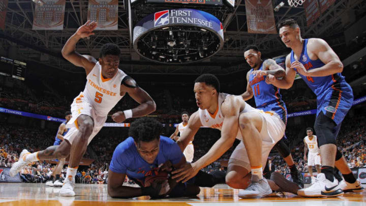 KNOXVILLE, TN - FEBRUARY 21: Admiral Schofield #5 and Grant Williams #2 of the Tennessee Volunteers go to the floor for a loose ball against Mike Okauru #0 of the Florida Gators in the first half of a game at Thompson-Boling Arena on February 21, 2018 in Knoxville, Tennessee. (Photo by Joe Robbins/Getty Images)