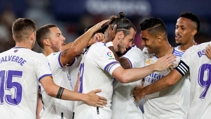 VALENCIA, SPAIN - AUGUST 22: Gareth Bale of Real Madrid celebrates goal 0-1 with Eden Hazard of Real Madrid, Carlos Henrique Casemiro of Real Madrid during the La Liga Santander match between Levante v Real Madrid at the Estadi Ciutat de Valencia on August 22, 2021 in Valencia Spain (Photo by David S. Bustamante/Soccrates/Getty Images)