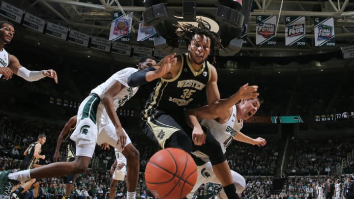 EAST LANSING, MI - DECEMBER 29: Brandon Johnson #35 of the Western Michigan Broncos and Conner George #41 of the Michigan State Spartans battle for a loose ball in the second half at Breslin Center on December 29, 2019 in East Lansing, Michigan. (Photo by Rey Del Rio/Getty Images)