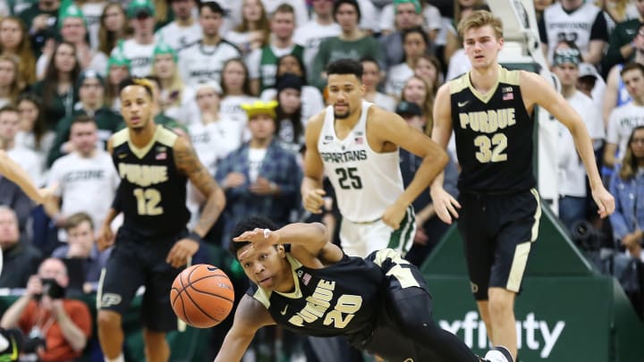 EAST LANSING, MI – FEBRUARY 10: Nojel Eastern #20 of the Purdue Boilermakers dives for a loose ball in the second half during a game against the Michigan State Spartans at Breslin Center on February 10, 2018 in East Lansing, Michigan. (Photo by Rey Del Rio/Getty Images)