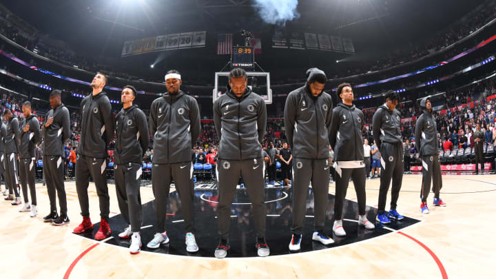 LOS ANGELES, CA – NOVEMBER 11: The LA Clippers stand for the National Anthem prior to the game against the Toronto Raptors on November 11, 2019 at STAPLES Center in Los Angeles, California. NOTE TO USER: User expressly acknowledges and agrees that, by downloading and/or using this Photograph, user is consenting to the terms and conditions of the Getty Images License Agreement. Mandatory Copyright Notice: Copyright 2019 NBAE (Photo by Adam Pantozzi/NBAE via Getty Images)