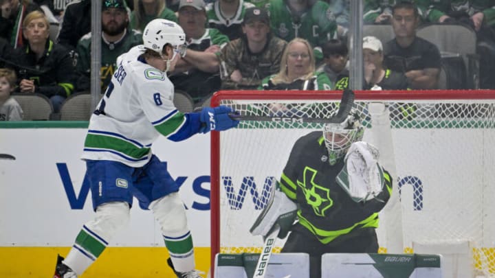 Mar 25, 2023; Dallas, Texas, USA; Vancouver Canucks right wing Brock Boeser (6) attempts to redirect the puck past Dallas Stars goaltender Matt Murray (32) during the second period at the American Airlines Center. Mandatory Credit: Jerome Miron-USA TODAY Sports