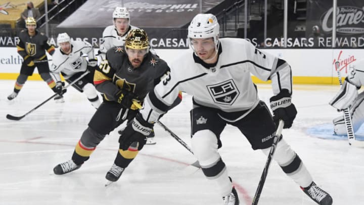 LAS VEGAS, NEVADA - MARCH 29: Matt Roy #3 of the Los Angeles Kings skates with the puck ahead of Chandler Stephenson #20 of the Vegas Golden Knights in the second period of their game at T-Mobile Arena on March 29, 2021 in Las Vegas, Nevada. The Golden Knights defeated the Kings 4-1. (Photo by Ethan Miller/Getty Images)