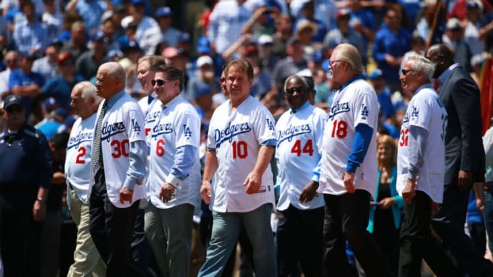 LOS ANGELES, CA - APRIL 12: (L-R) Former Los Angeles Dodgers manager Tommy Lasorda and former Dodgers players Maury Wills, Orel Hershiser, Steve Garvey, Ron Cey, Al Downing, Bill Russell and Sandy Koufax walk toward homeplate during pre-game ceremonies prior to the MLB game between the Arizona Diamondbacks and the Los Angeles Dodgers at Dodger Stadium on April 12, 2016 in Los Angeles, California. The Diamondback defeated the Dodgers 4-2. (Photo by Victor Decolongon/Getty Images)