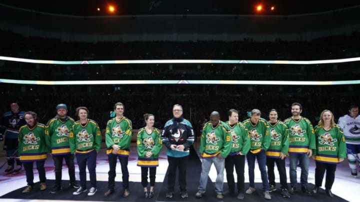 ANAHEIM, CA - FEBRUARY 13: Members of the cast and crew from the original Mighty Ducks movie line up for the ceremonial puck drop prior to the game between the Anaheim Ducks and the Vancouver Canucks on February 13, 2019 at Honda Center in Anaheim, California. (Photo by Debora Robinson/NHLI via Getty Images)