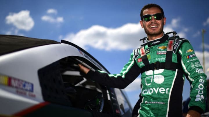 DARLINGTON, SOUTH CAROLINA - AUGUST 31: Kyle Larson, driver of the #42 Clover Chevrolet, climbs into his car during qualifying for the Monster Energy NASCAR Cup Series Bojangles' Southern 500 at Darlington Raceway on August 31, 2019 in Darlington, South Carolina. (Photo by Jared C. Tilton/Getty Images)