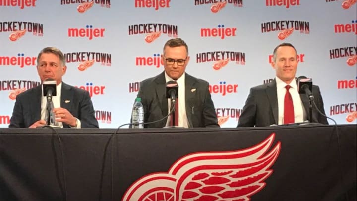 From left: Ken Holland, Steve Yzerman and Christopher Ilitch at Little Caesars Arena in Detroit on April 19, 2019.Wings Conference2
