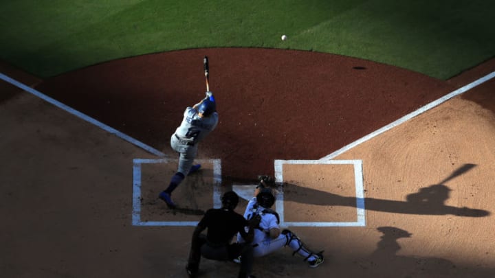 SAN DIEGO, CALIFORNIA - MAY 04: Enrique Hernandez #14 of the Los Angeles Dodgers grounds out as Austin Hedges #18 of the San Diego Padres and umpire Alan Porter #64 look on during the first inning of a game at PETCO Park on May 04, 2019 in San Diego, California. (Photo by Sean M. Haffey/Getty Images)