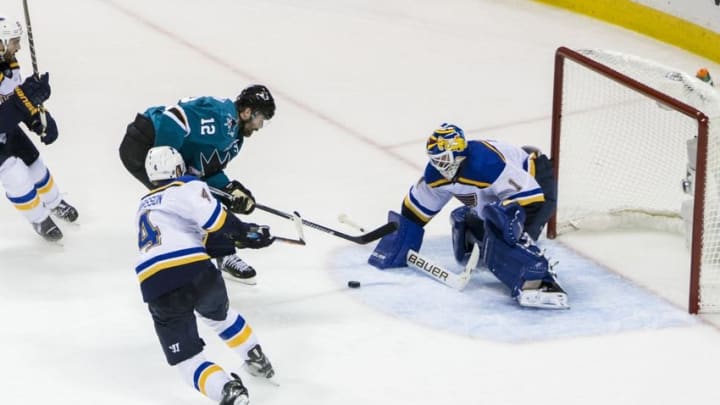 May 25, 2016; San Jose, CA, USA; St. Louis Blues goalie Brian Elliott (1) deflects a shot by San Jose Sharks left wing Patrick Marleau (12) in the third period of game six in the Western Conference Final of the 2016 Stanley Cup Playoffs at SAP Center at San Jose. The Sharks won 5-2. Mandatory Credit: John Hefti-USA TODAY Sports